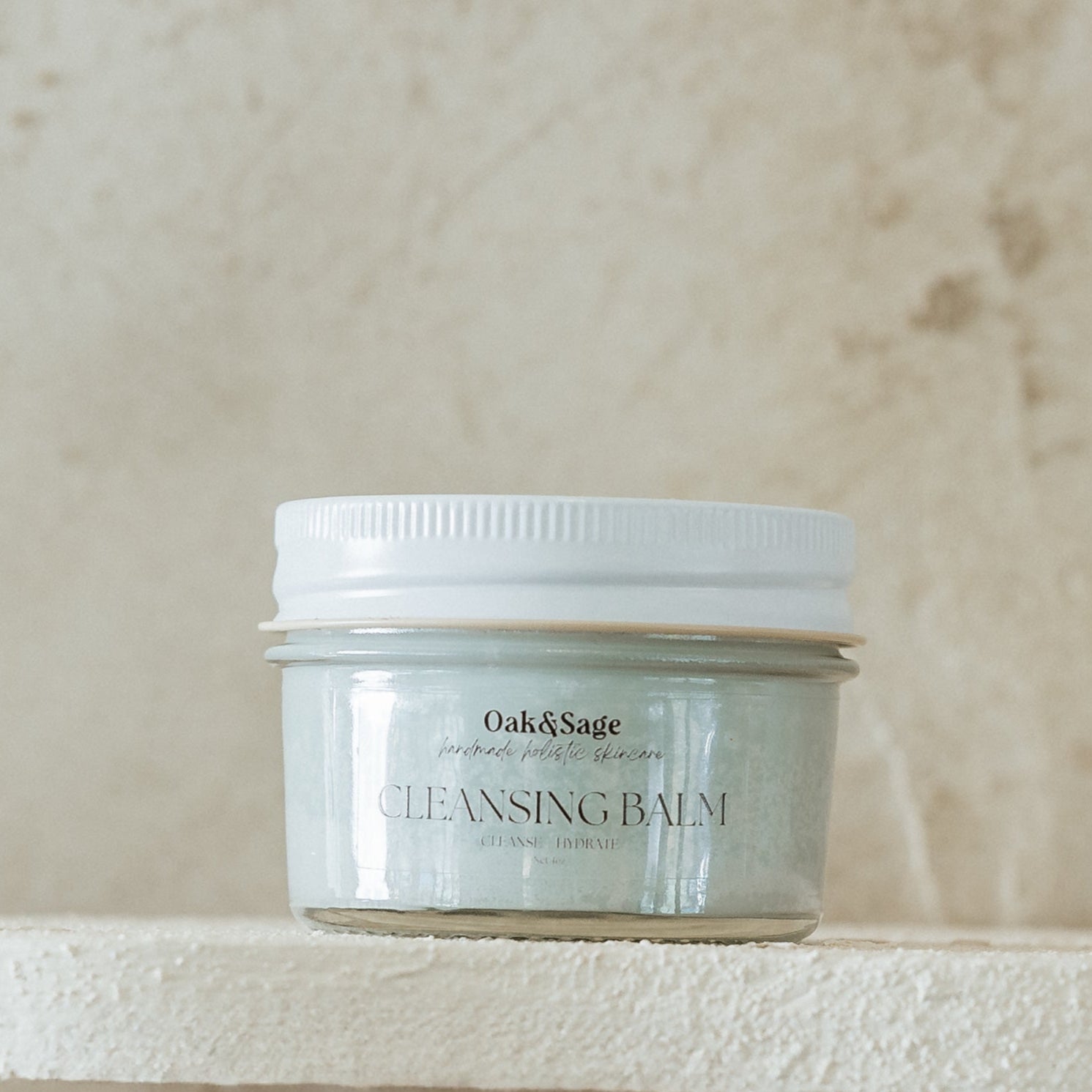Oak & Sage Cleansing Balm in glass jar with white lid – natural tallow-based facial cleanser with jojoba oil and blue tansy for gentle, effective cleansing and hydration.