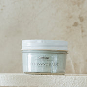 Oak & Sage Cleansing Balm in glass jar with white lid – natural tallow-based facial cleanser with jojoba oil and blue tansy for gentle, effective cleansing and hydration.