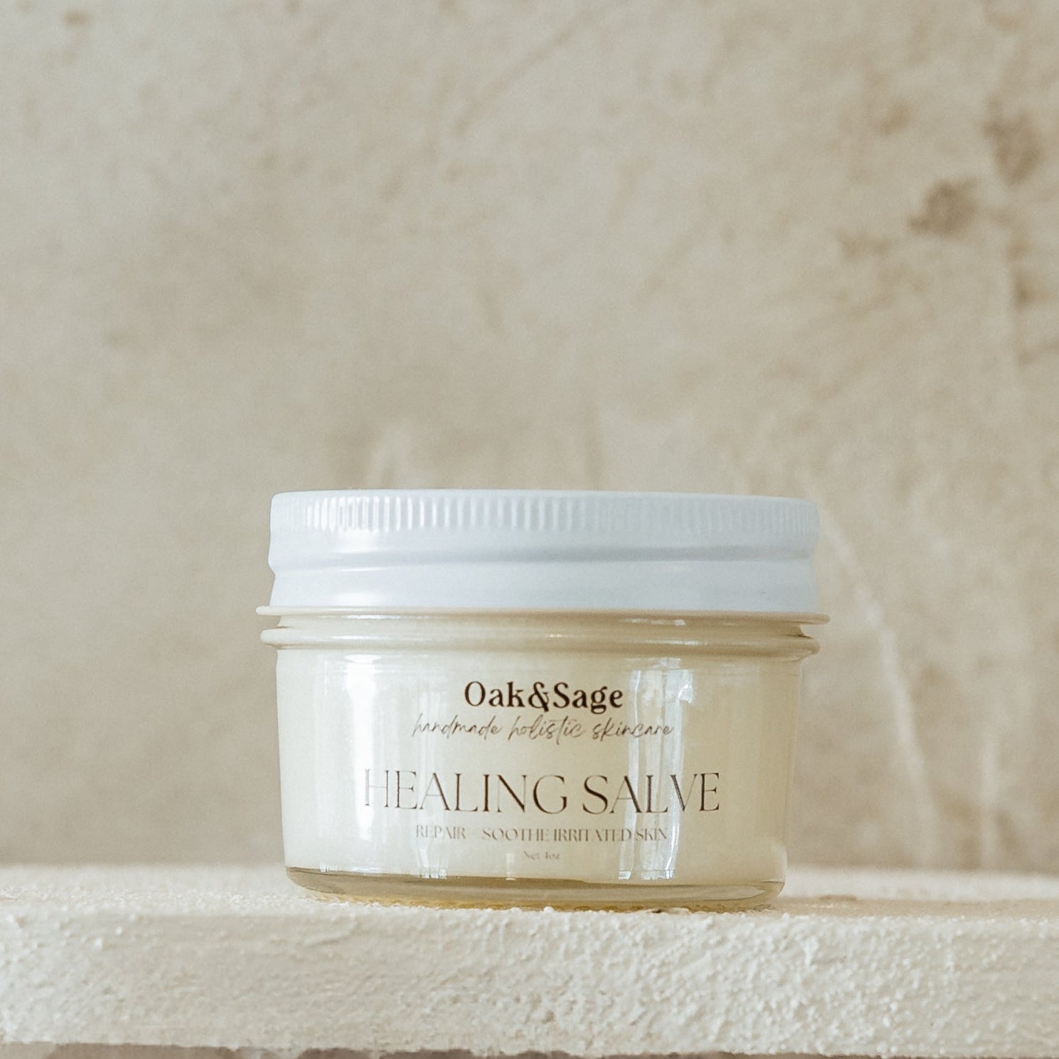 Oak & Sage Healing Salve in 4 oz glass jar, designed to repair and soothe irritated skin with natural tallow, calendula, and jojoba oil.