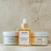 Oak & Sage Complete Skincare Set featuring Radiant Serum, Cleansing Balm, and Youthful Cream in eco-friendly glass packaging for a simple 3-step natural skincare routine.