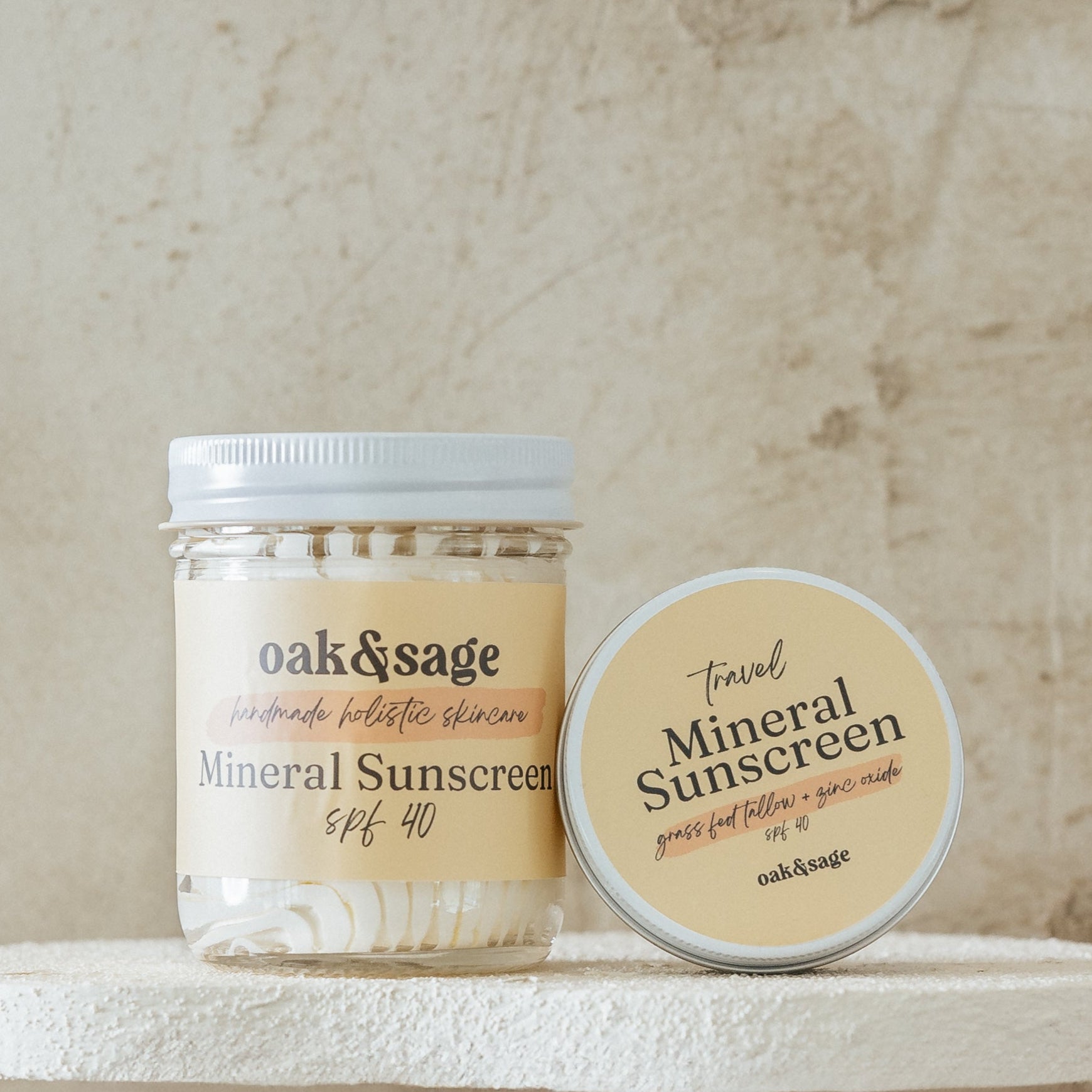 Oak & Sage Mineral Sunscreen in 8 oz glass jar and 2 oz travel tin, made with grass-fed tallow and non-nano zinc oxide, SPF 40.