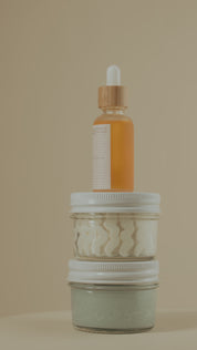 360-degree rotating view of Oak & Sage Complete Skincare Set with Exfoliating Balm, Youthful Cream, and Radiant Serum stacked in order, transitioning to slow motion as product labels face the camera for a clean, luxurious product reveal.