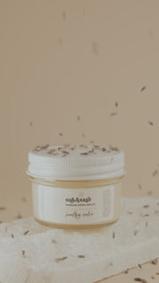 Oak & Sage Healing Salve being opened and applied to skin, highlighting creamy, nourishing texture of natural tallow balm for eczema, rashes, and dry skin